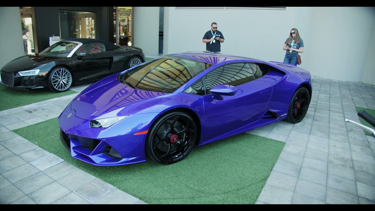 A luxury sports car on display in a showroom 
