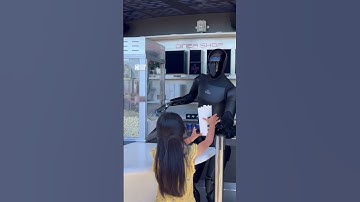 Optimus serving popcorn at the Tesla Diner #fyp #viral #tesla #optimus #teslarobot