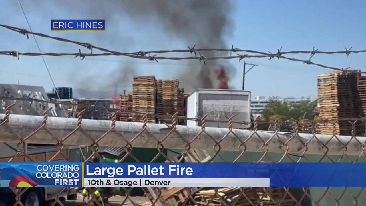 Pallet fire extinguished near light rail tracks in Denver
