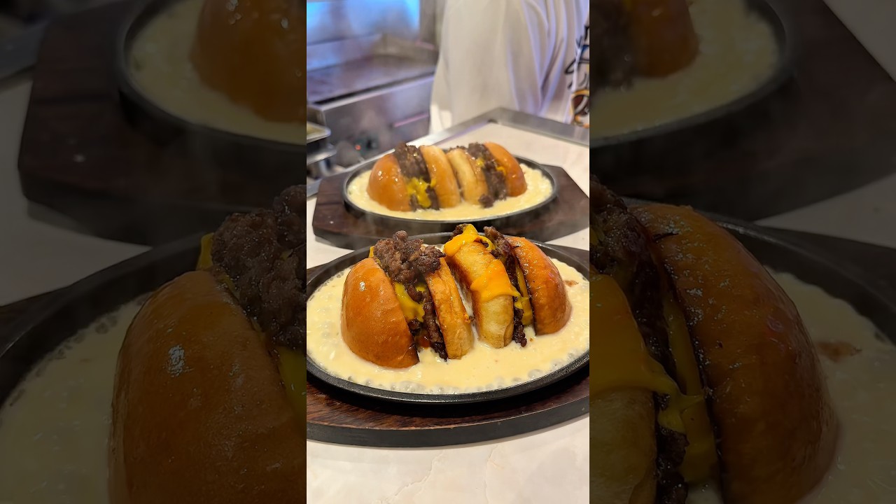 A burger drowning in cheese 🍔