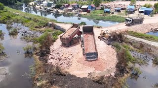 So Wonder Move On Mountain Stone Operated By KOMATSU Dozers Push Filling Flood Land And Trucks Dump