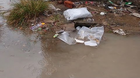 Remove plastic Unclog Mini Culvert pipe avoid  Water flooding the Street road