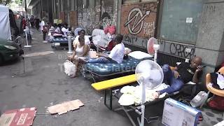 Evacuees from occupied Rome building camp through heat wave with their future uncertain