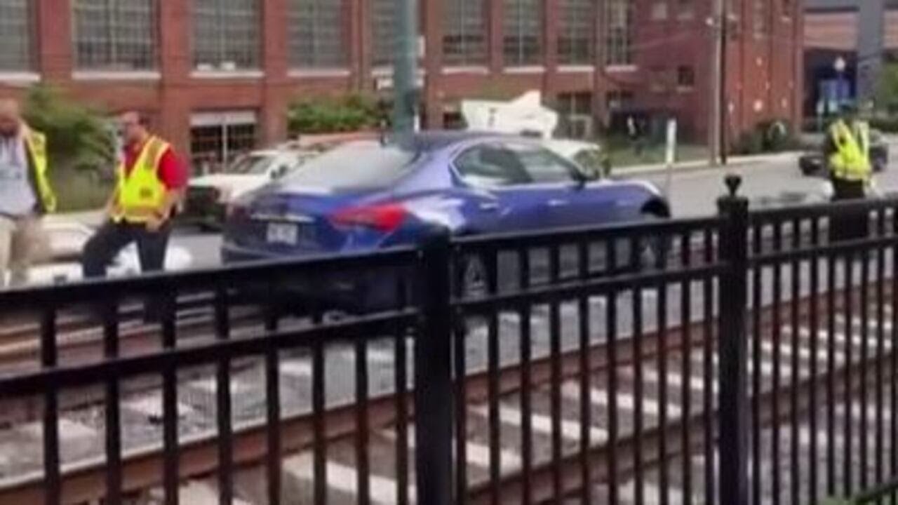 Luxury car spotted on light rail tracks in Charlotte’s South End - YouTube