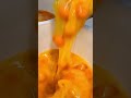 An egg in a large amount that is being poured into a container and will be processed