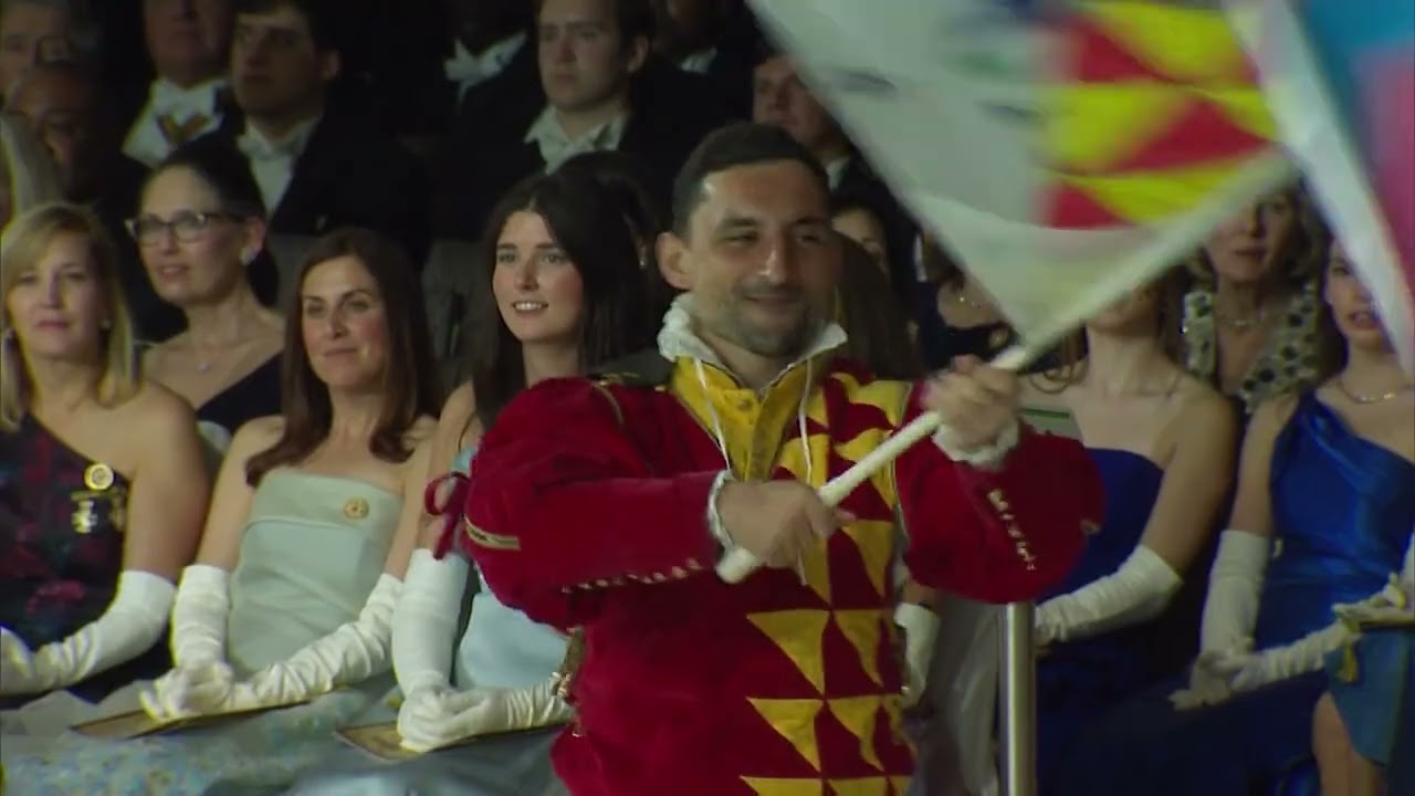 Gruppo Sbandieratori di Sansepolcro flag throwers perform on 2023 WYES Rex Ball Mardi Gras broadcast