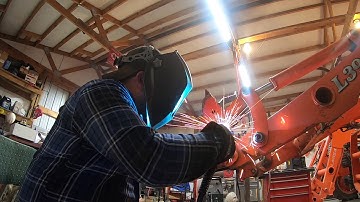 How to fix a bent skid steer style quick attach coupler on a tractor and a cracked front gear case.