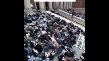 Harvard students staging a die-in on the steps of Widener Library to protest Israel