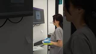 Santina, from Bari — replacing older porcelain dental work at a partner clinic in Tirana