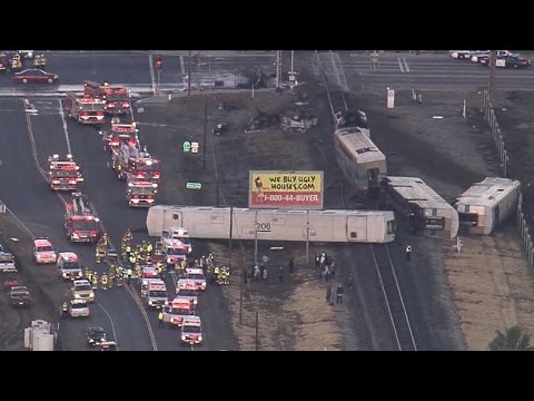 Dozens hurt after California commuter train collides with truck