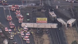 Dozens hurt after California commuter train collides with truck