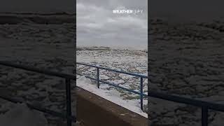 An Ocean Of Ice Waves Crashing Into Shore