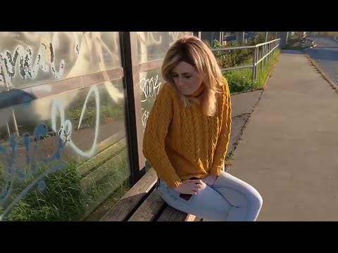 Girl has a Pee desperation on Bus Stop