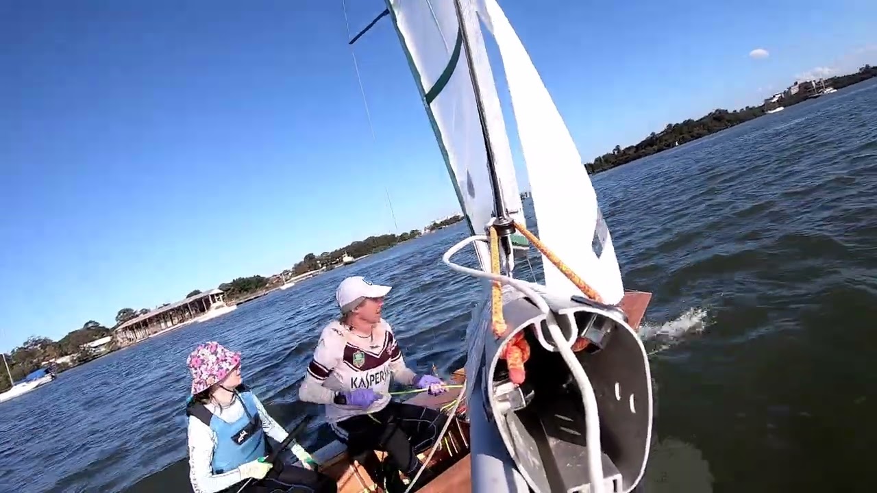250913 #5 Greg and Francesca sailing the Rainbow 'Lorikeet' at CRSC. Final lap Francesca skippering