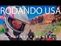 Rodando usa en moto junto a un alce