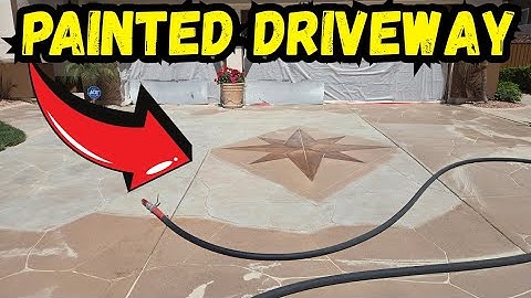 REMOVING PAINT AND STAIN FROM A CONCRETE DRIVEWAY BY SANDBLASTING