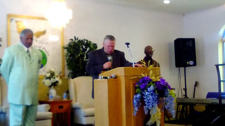Minister Clifton Byrd prays at Assembly of Praise