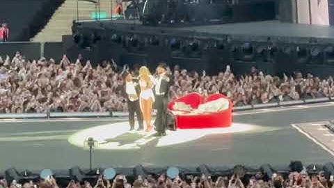 Travis Kelce at Eras Tour carrying Taylor Swift for I Can Do It With A Broken Heart