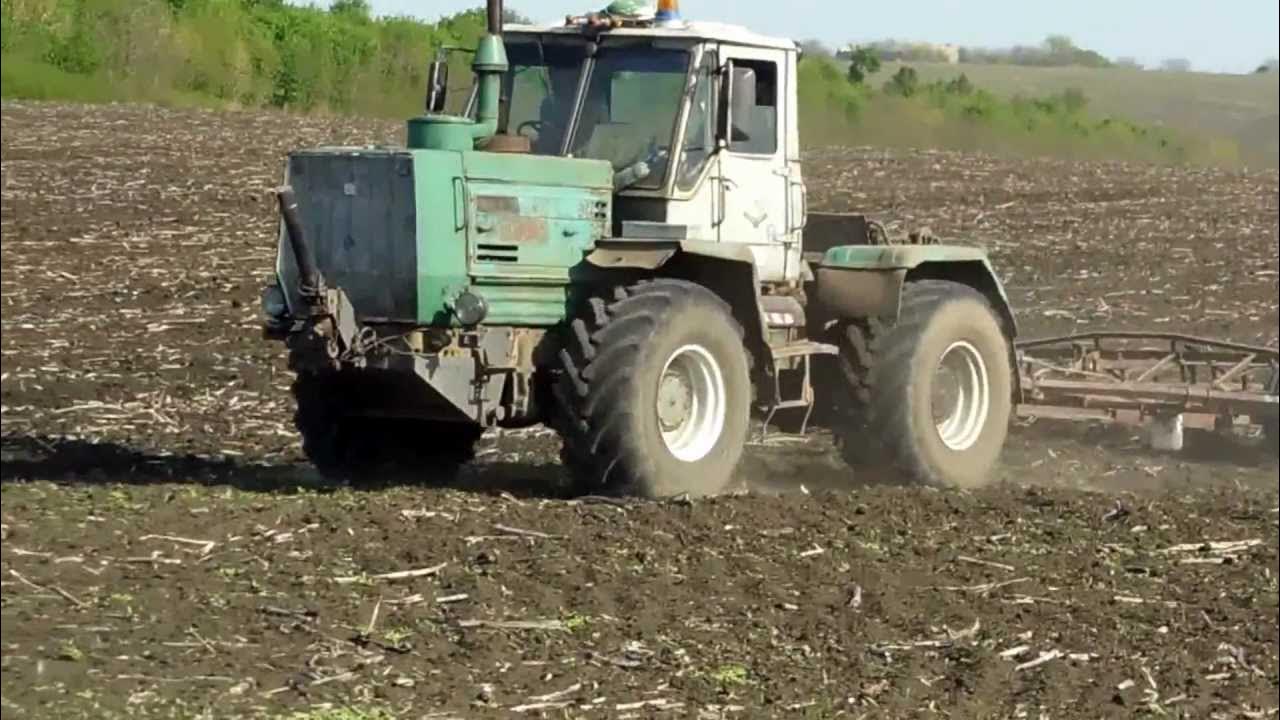 Трактор т 150 видео. Т 150 траншеекопатель. т-150к трактор. т 150 пзм-2. т150 гусеничный с плугом.