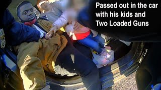 Officers find man passed out in his car with two children and two guns
