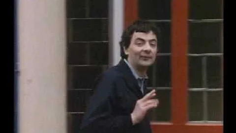 Rowan Atkinson in "Not The Nine'O Clock News" - be...