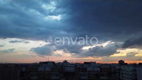 Nightfall Over the Big City. Fast Moving Clouds. | Stock Footage - Envato elements