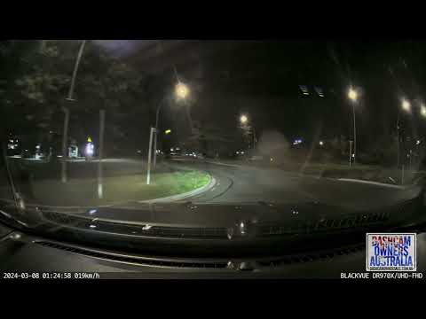Car jumps roundabout 