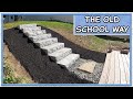 Laying solid grey granite steps by hand