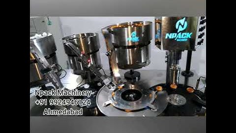 spout cap assembly machine