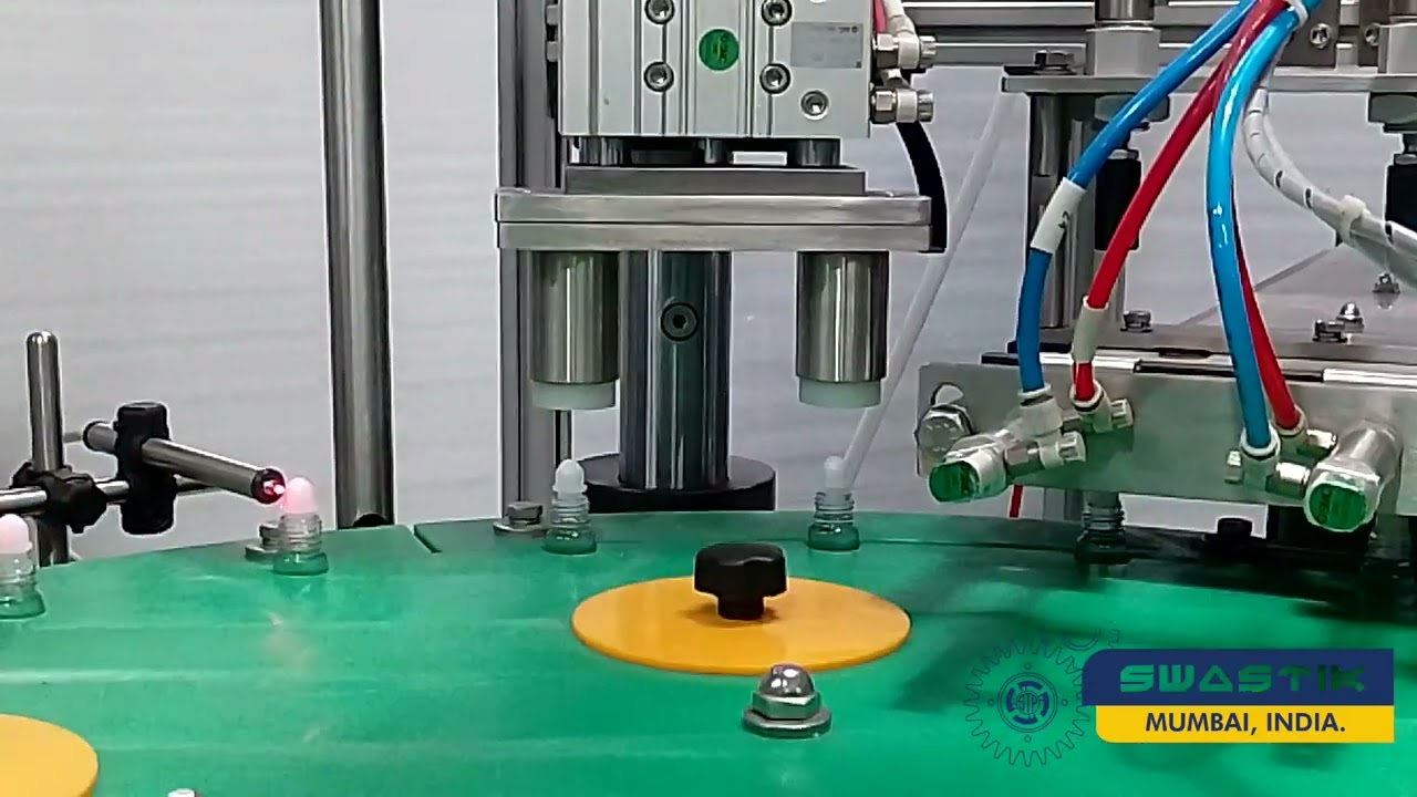 Auto Rollon Attar Tola Filling, Ball Pressing & Screw Capping Machine - Swastik Technopack Pvt. Ltd.