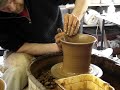 Throwing making a batch of clay pottery plant pots / flowerpots at speed / fast /quickly