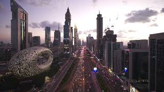 4K Aerial view of futuristic Dubai skyline at night