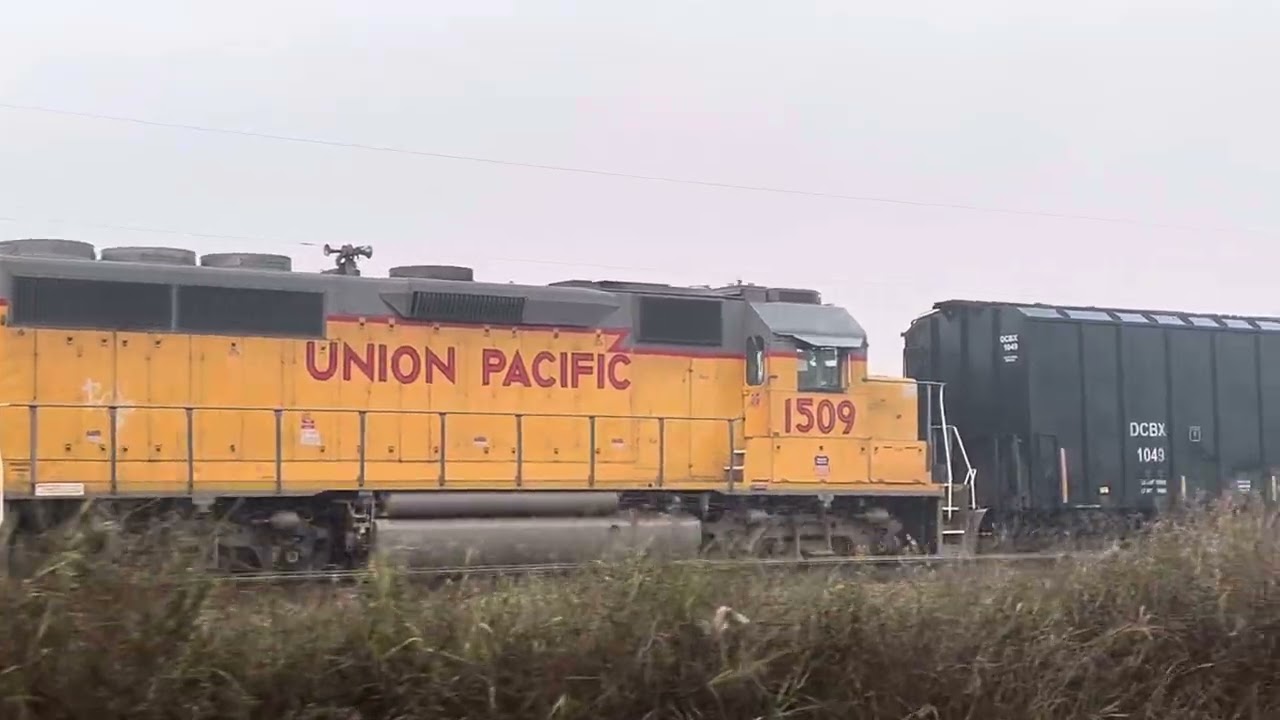 Roll by the New Iberia depot Amtrak bad order car from Baldwin and UP local still here switch moving