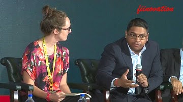 Soumitro Chakraborty interacting with Anna Warrington at a Environment Management conference