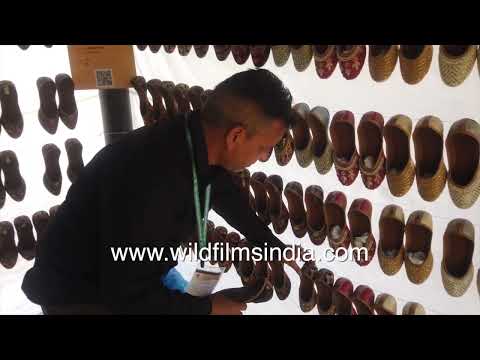 Juttis and Kolhapuri chappals displayed at a Surajkund crafts stall