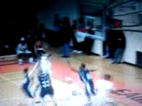 Thomas Feeney dunks on two people in a high school...