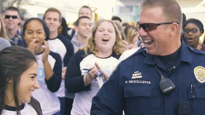 Massive mob overwhelms school's favorite police of...