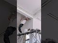 the process of installing a decorative sticker that is attached to the ceiling of the house