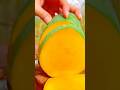 Peeling a ripe green mango with thin, precise slices using a sharp knife #shorts