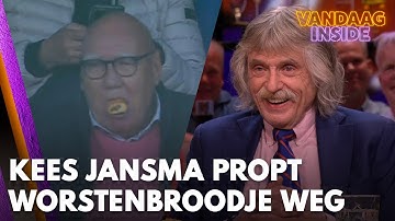 Johan lacht om beelden van Kees Jansma die opzichtig een worstenbroodje naar binnen propt