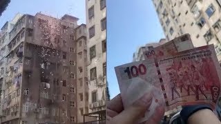 It was raining money in one of hong kong's poorest neighborhoods on
december 15 as banknotes worth 100 kong dollars each (around 13 u.s.
dollars) flutte...