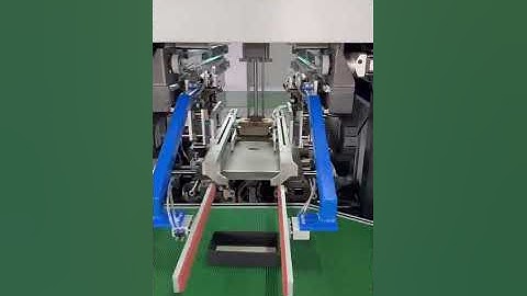 Rigid box wrapping machine with mechanical arm