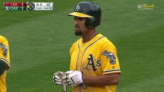 LAA@OAK: Rosales races home on Trout's fielding error
