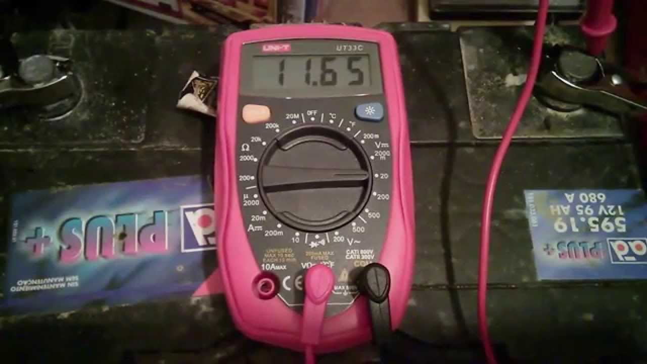 How do you test a battery with a multimeter?