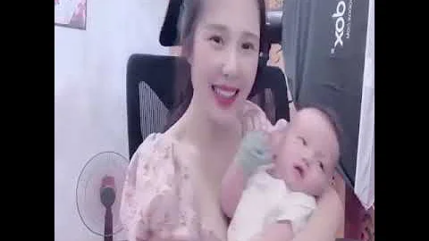 desi mom breastfeeding in her child