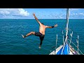 Enjoying the freedom of the sailing life with a bow jump in paradise