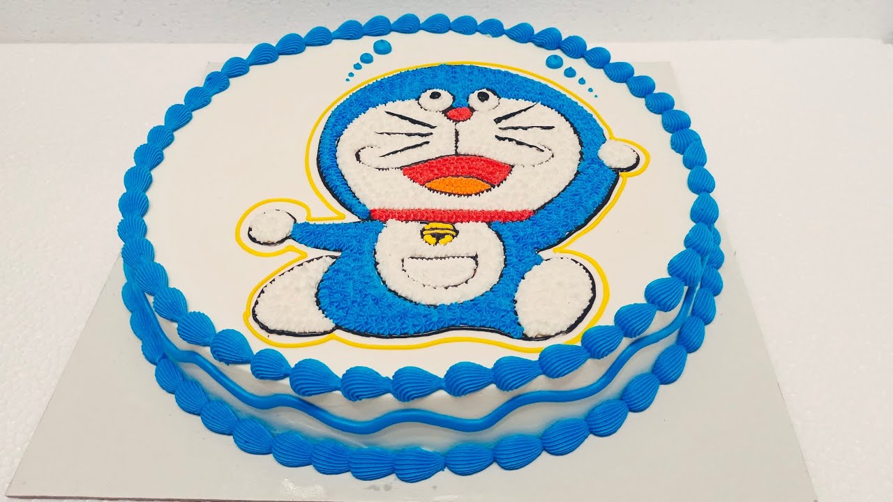 Round shape buttercream birthday cake Doraemon image drawing ...