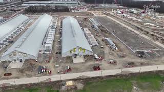 Meta data centers hidden behind massive green fence