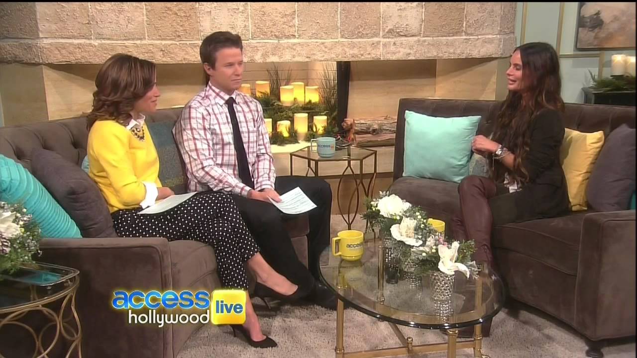 Gabrielle Anwar chats in thigh high boots