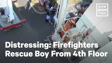 Firefighters in China Rescue Boy Hanging from 4th-Floor Window | NowThis